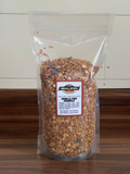 Packaged granola with a label on a wooden surface